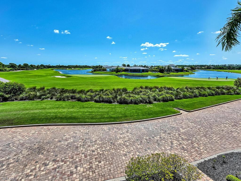 9115 Napoli Court, Unit 101 Naples, FL 34113 - Photo 49 of 49 a view of a golf course with a big yard