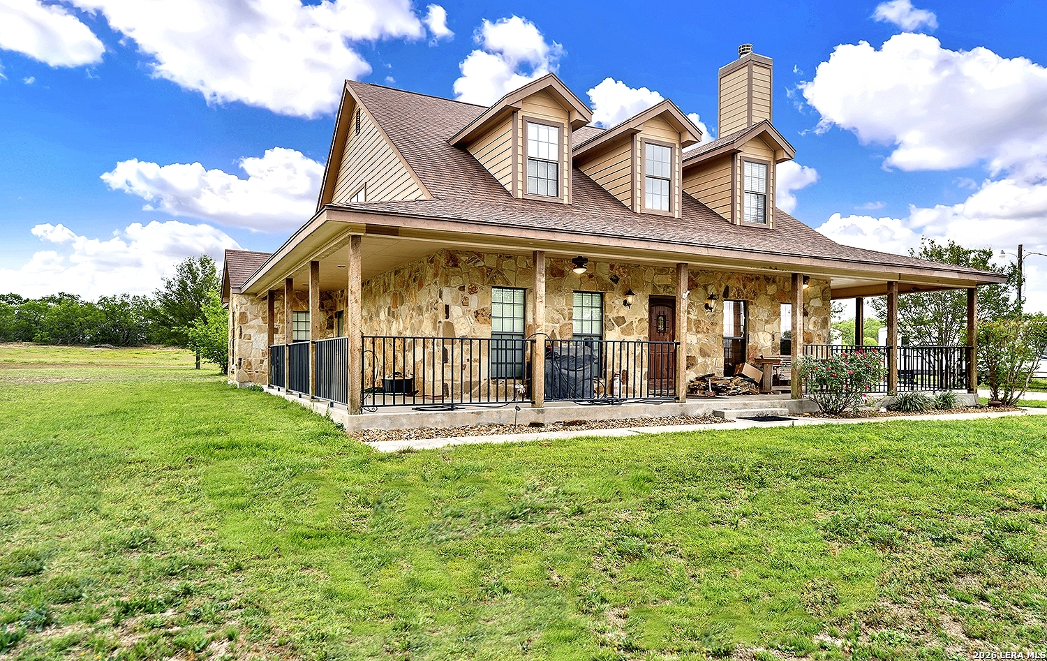 3283 Hartfield Road La Vernia, TX 78121 - Photo 2 of 40 front view of a house with a yard