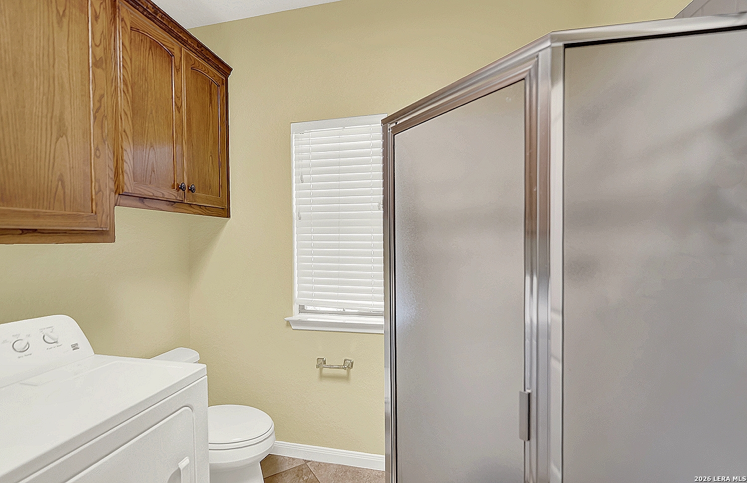 3283 Hartfield Road La Vernia, TX 78121 - Photo 21 of 40 a bathroom with a shower and a toilet