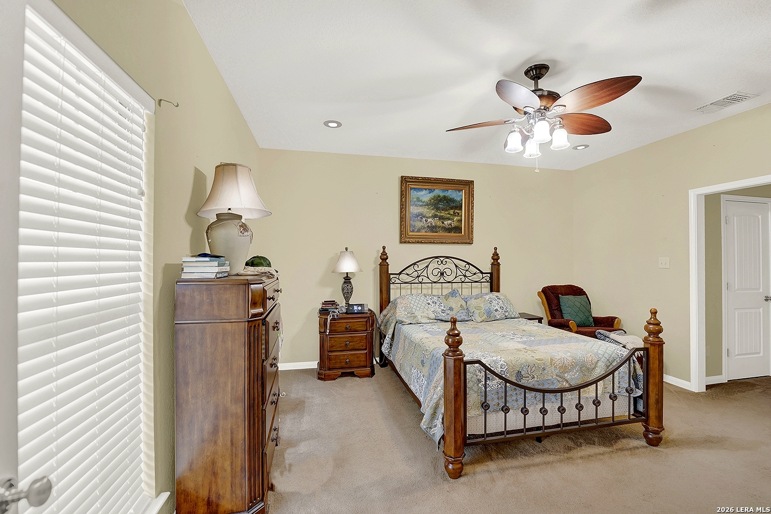 3283 Hartfield Road La Vernia, TX 78121 - Photo 22 of 40 a bedroom with furniture and a chandelier