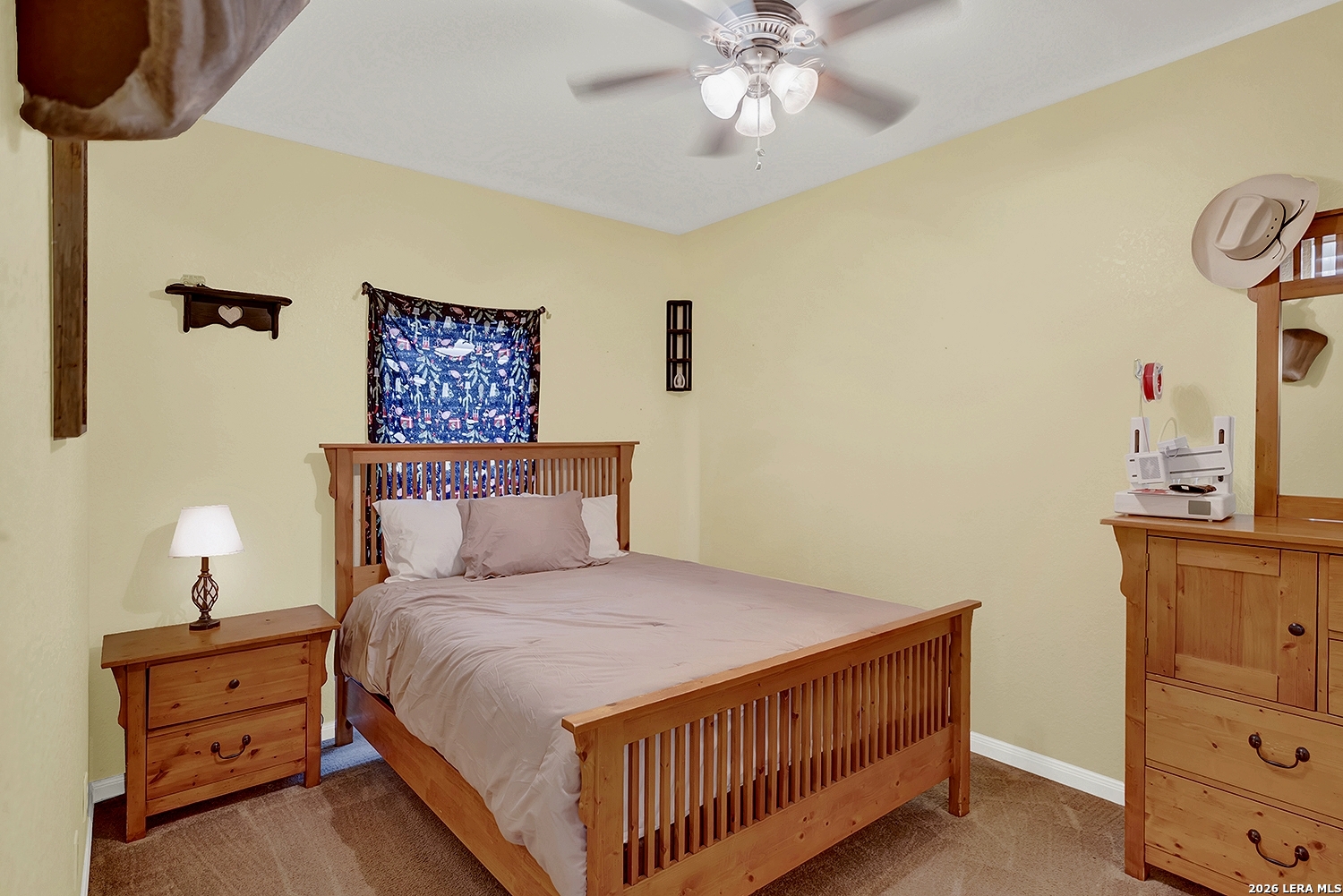 3283 Hartfield Road La Vernia, TX 78121 - Photo 26 of 40 a bedroom with a bed and cabinets