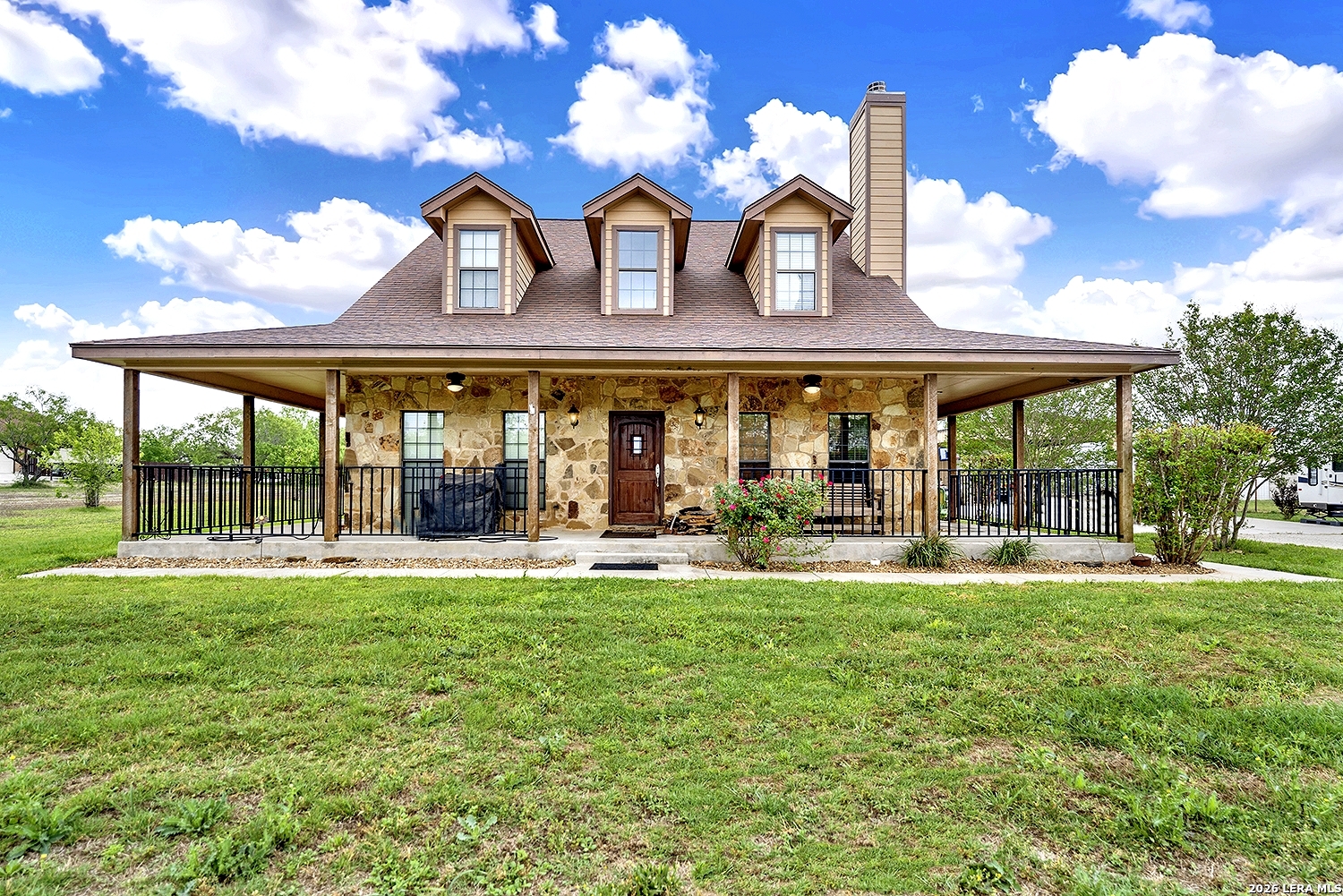 3283 Hartfield Road La Vernia, TX 78121 - Photo 36 of 40 front view of a house with a yard