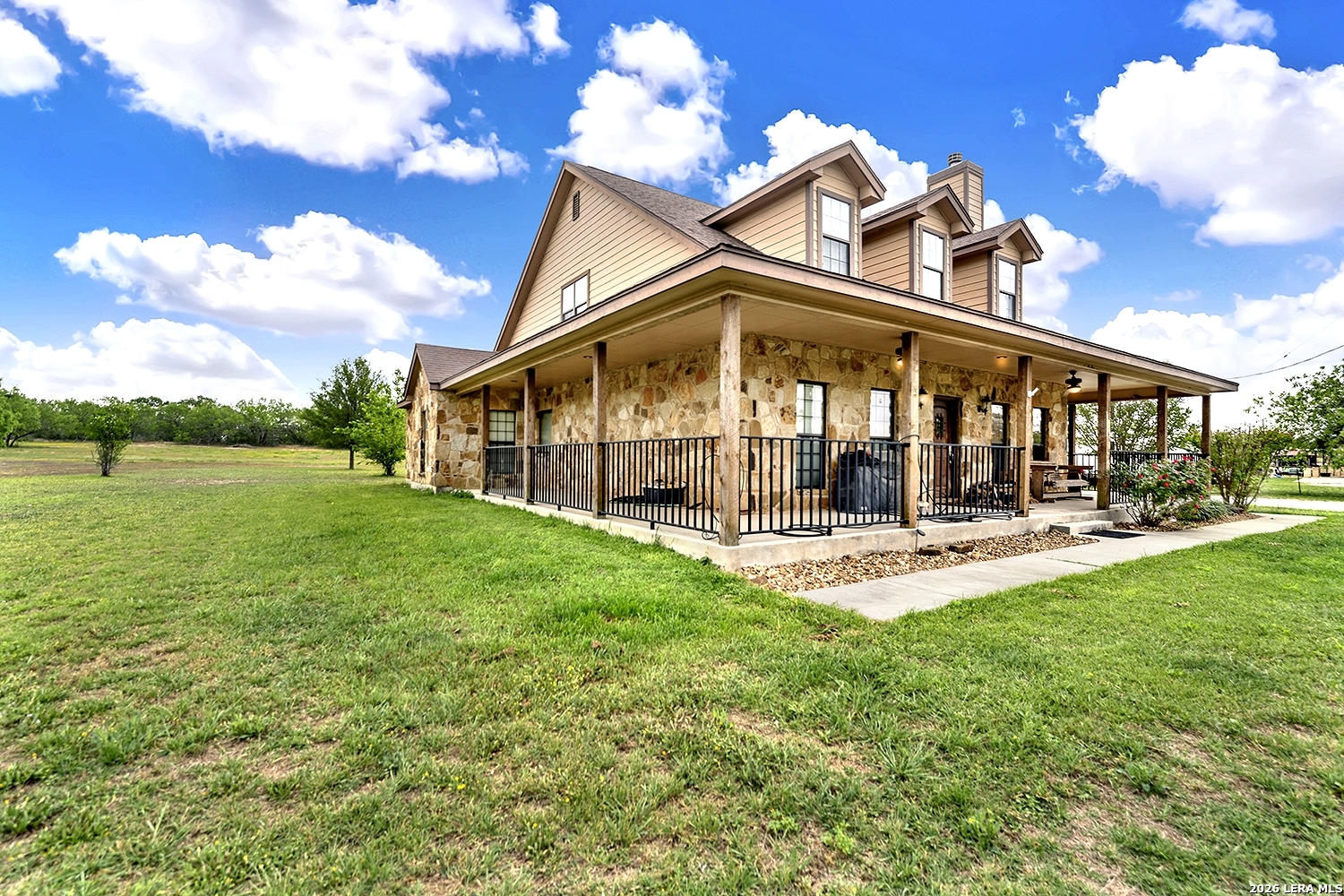 3283 Hartfield Road La Vernia, TX 78121 - Photo 37 of 40 a view of a house with backyard porch and sitting area