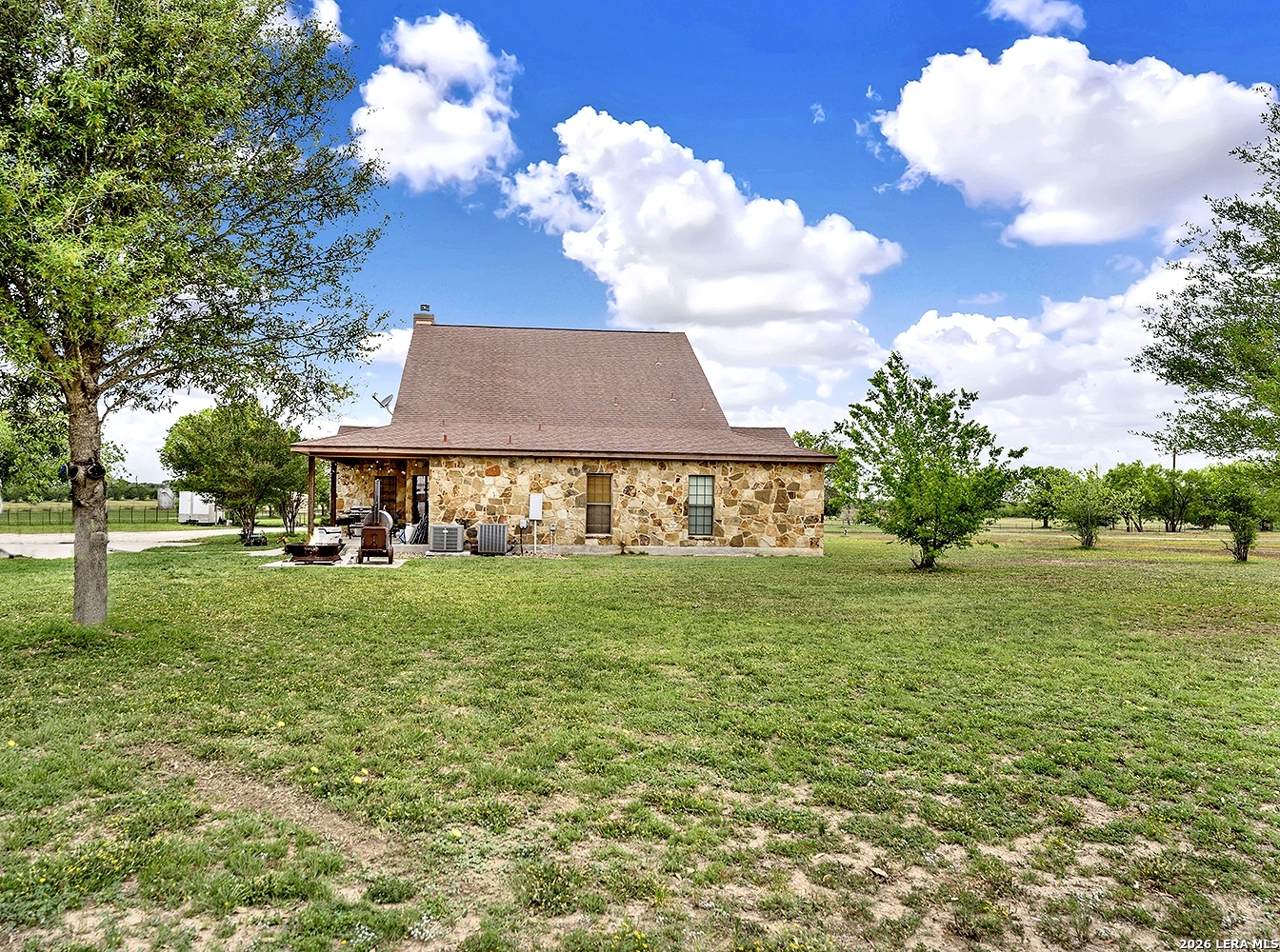 3283 Hartfield Road La Vernia, TX 78121 - Photo 39 of 40 a view of a house with a yard