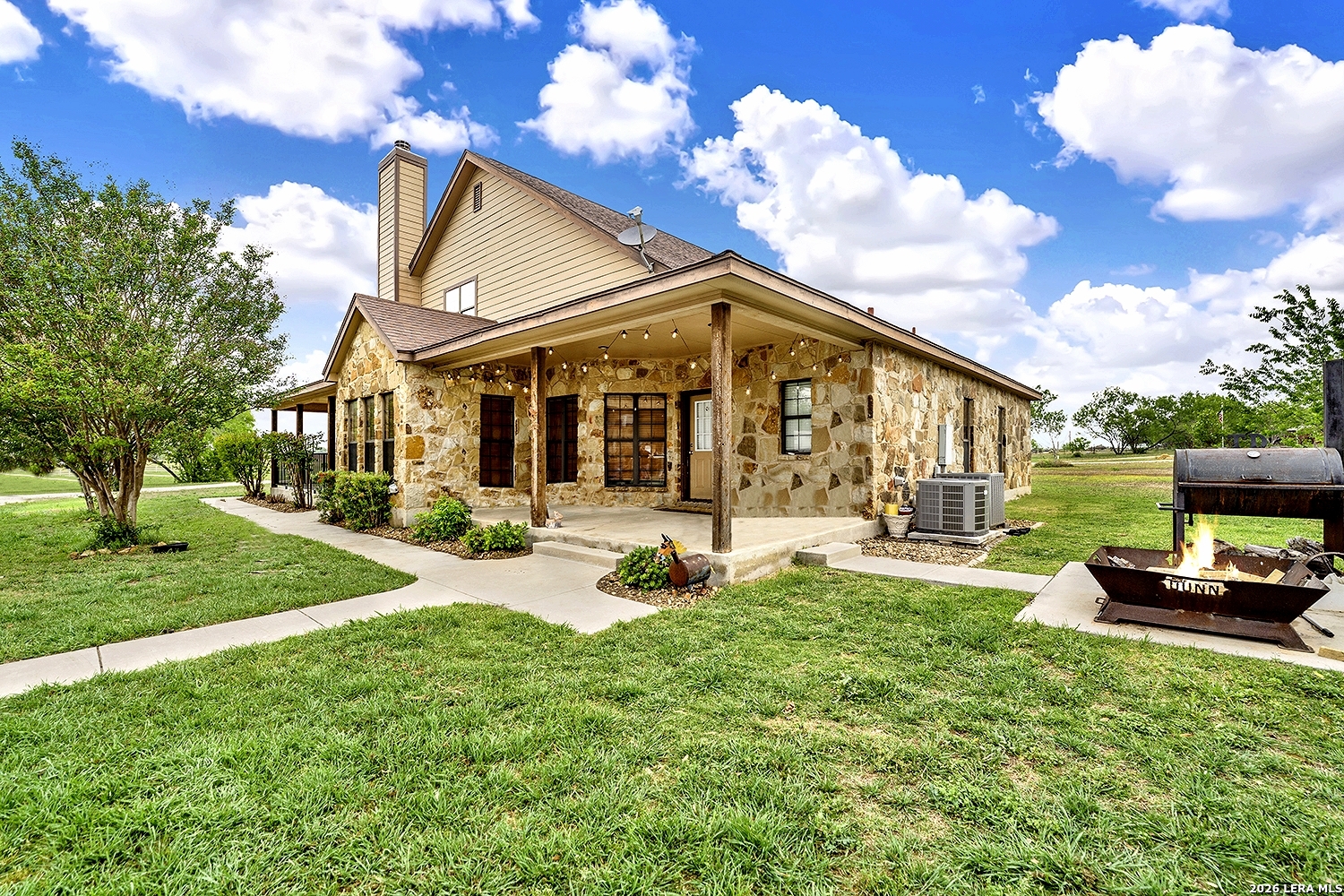 3283 Hartfield Road La Vernia, TX 78121 - Photo 40 of 40 a view of a house with a backyard porch and sitting area