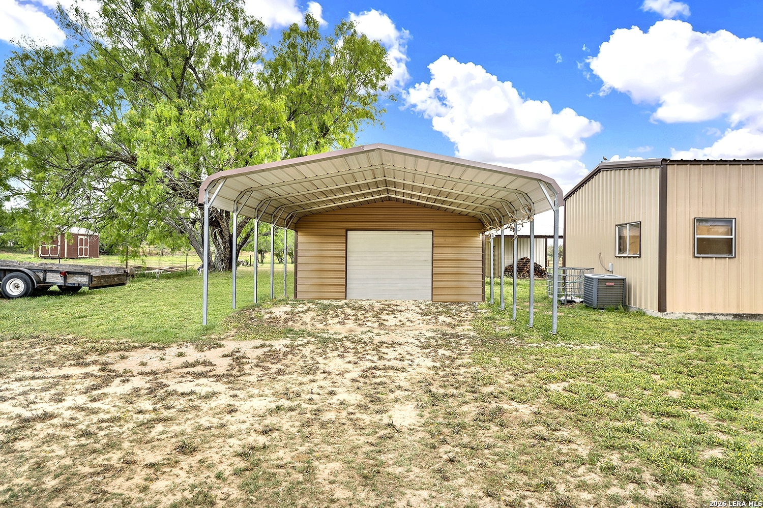 3283 Hartfield Road La Vernia, TX 78121 - Photo 4 of 40 a front view of a house with garden