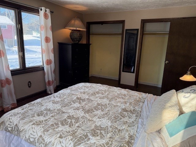 1 Bruce Street Avon, MA 02322 - Photo 11 of 23 a bedroom with a bed and a mirror