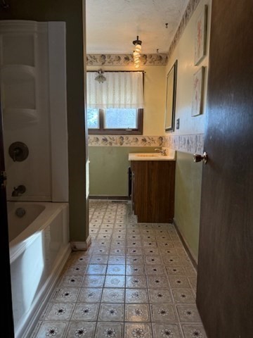 1 Bruce Street Avon, MA 02322 - Photo 14 of 23 a bathroom with a sink a toilet and bathtub