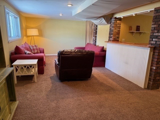 1 Bruce Street Avon, MA 02322 - Photo 16 of 23 a living room with furniture and a flat screen tv