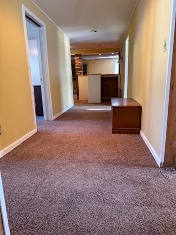 1 Bruce Street Avon, MA 02322 - Photo 18 of 23 an empty room with windows and fireplace