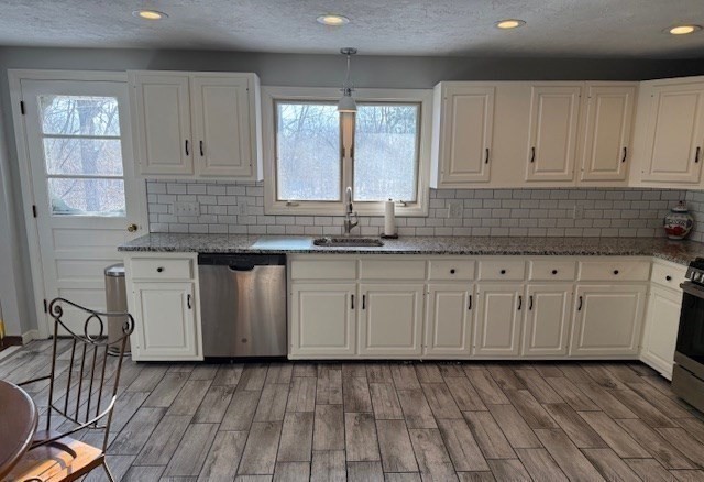 1 Bruce Street Avon, MA 02322 - Photo 2 of 23 a kitchen with granite countertop white cabinets white appliances a sink and a window