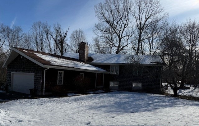 1 Bruce Street Avon, MA 02322 - Photo 21 of 23 a front view of a house with a yard and garage