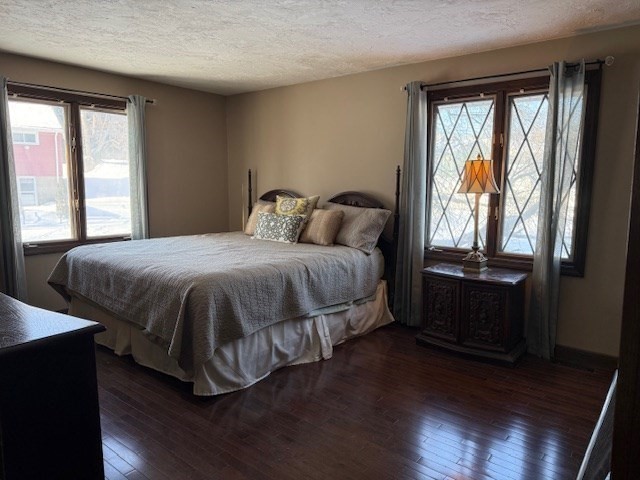 1 Bruce Street Avon, MA 02322 - Photo 9 of 23 a bedroom with a bed and wooden floor