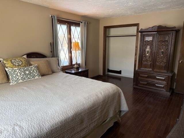 1 Bruce Street Avon, MA 02322 - Photo 10 of 23 a bedroom with a bed dresser and a window