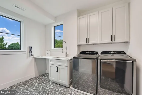 a kitchen with a stove and a sink