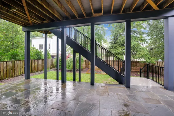 a view of porch with a floor to ceiling window and stairs