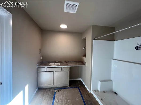 a view of a room with racks on the wall