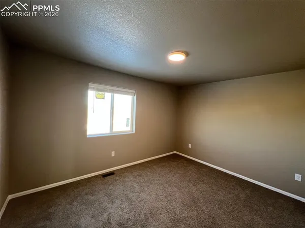a view of a room with a garage