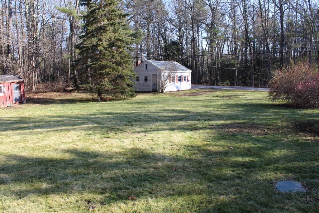 98 North Brookfield Road Oakham, MA 01068 - Photo 5 of 19 a view of a fountain in front of the house