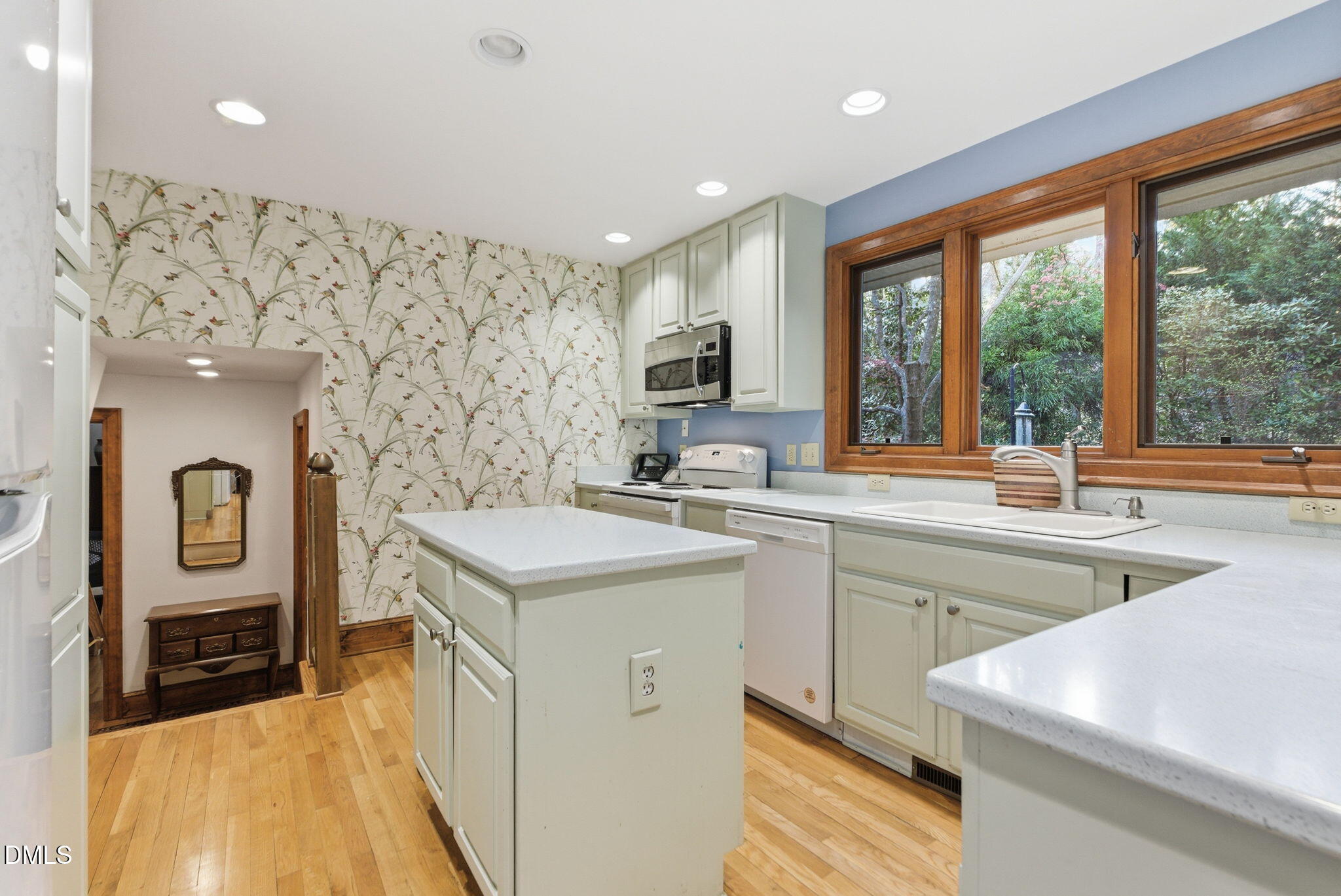1513 Dellwood Drive Raleigh, NC 27607 - Photo 14 of 76 a kitchen with stainless steel appliances granite countertop a sink and a stove