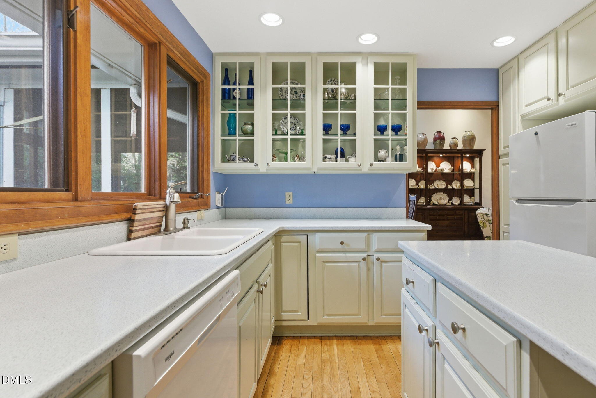 1513 Dellwood Drive Raleigh, NC 27607 - Photo 17 of 76 a kitchen with a sink stove and refrigerator