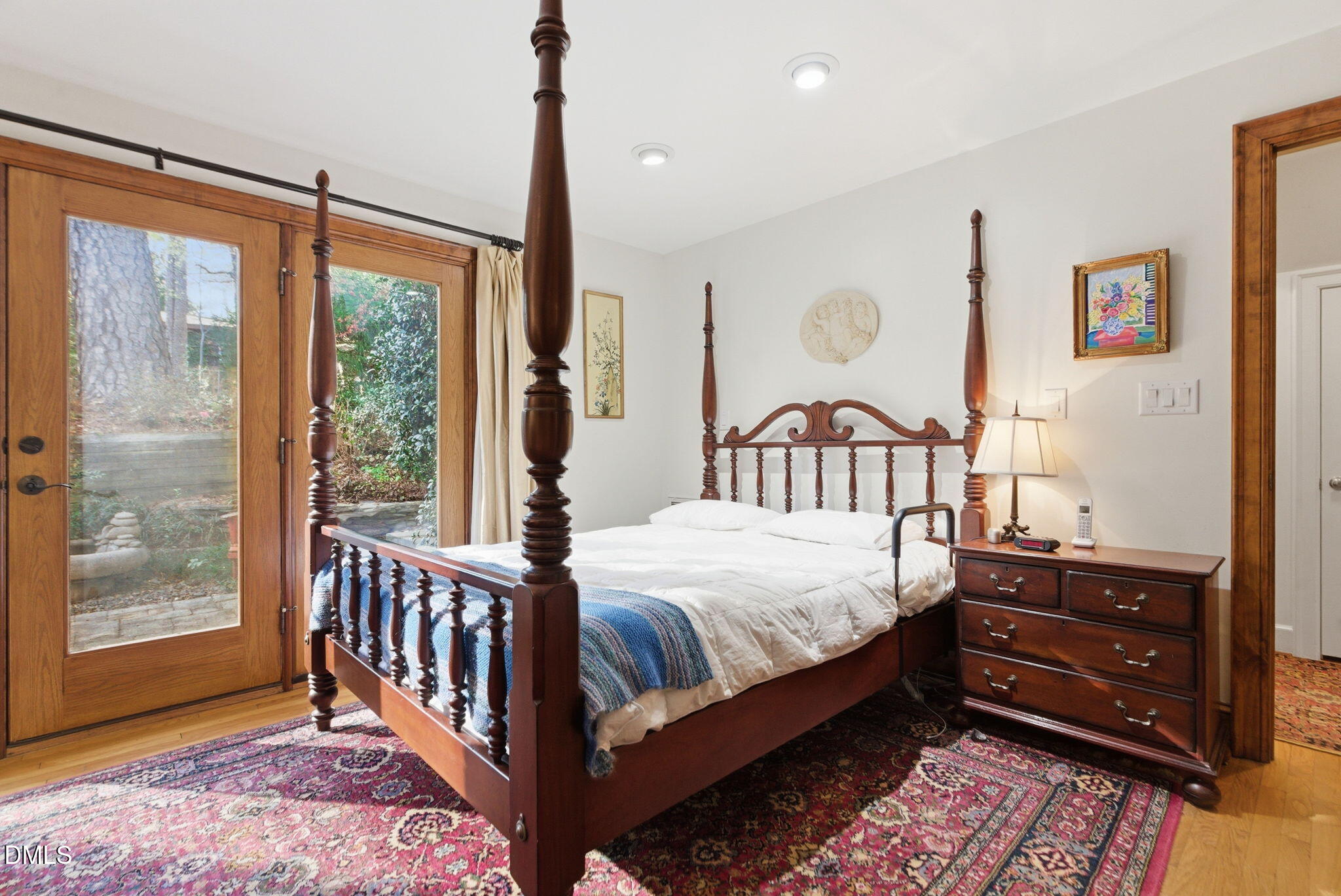 1513 Dellwood Drive Raleigh, NC 27607 - Photo 22 of 76 a bedroom with a bed next to a large window