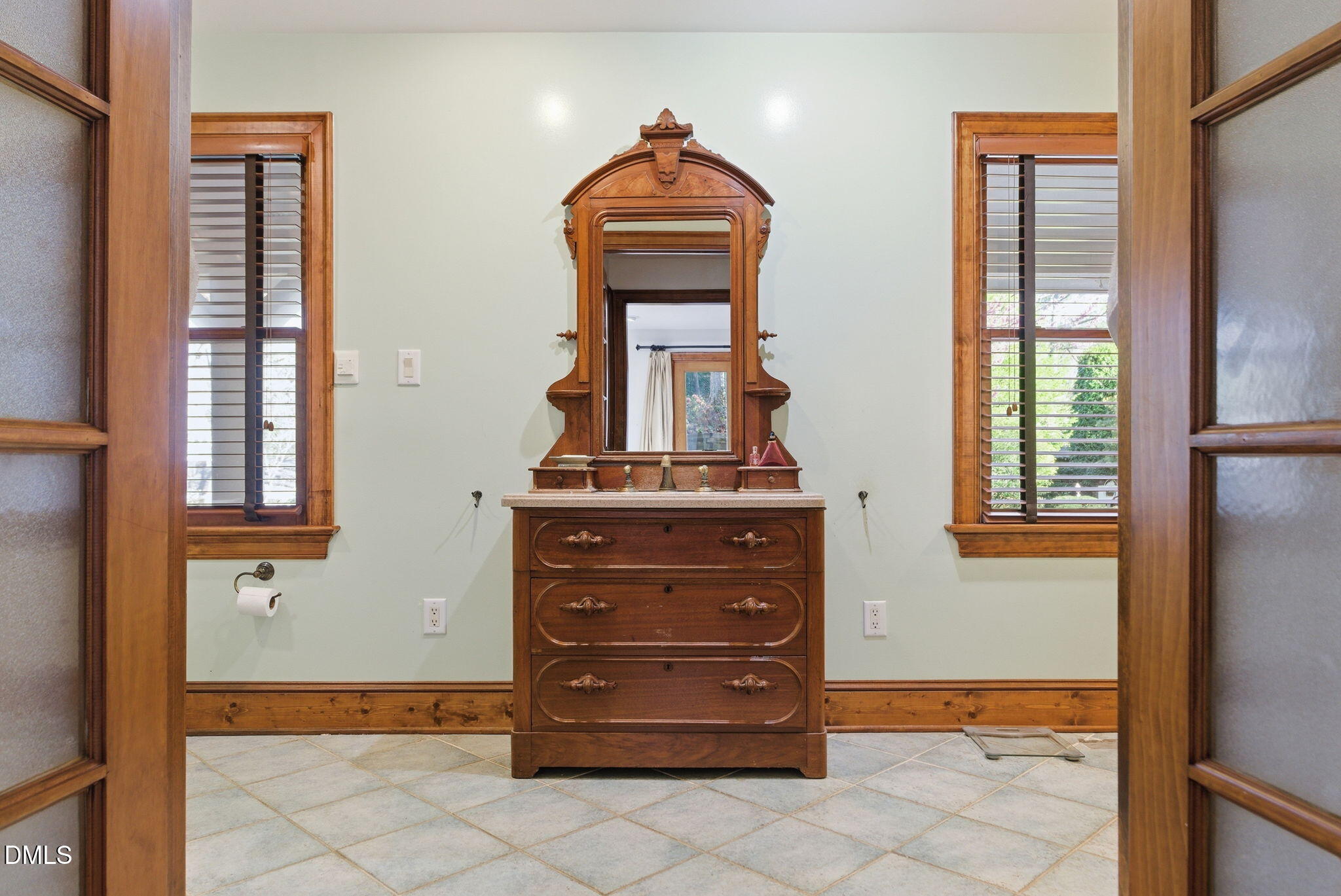 1513 Dellwood Drive Raleigh, NC 27607 - Photo 28 of 76 a room with a dresser and a window