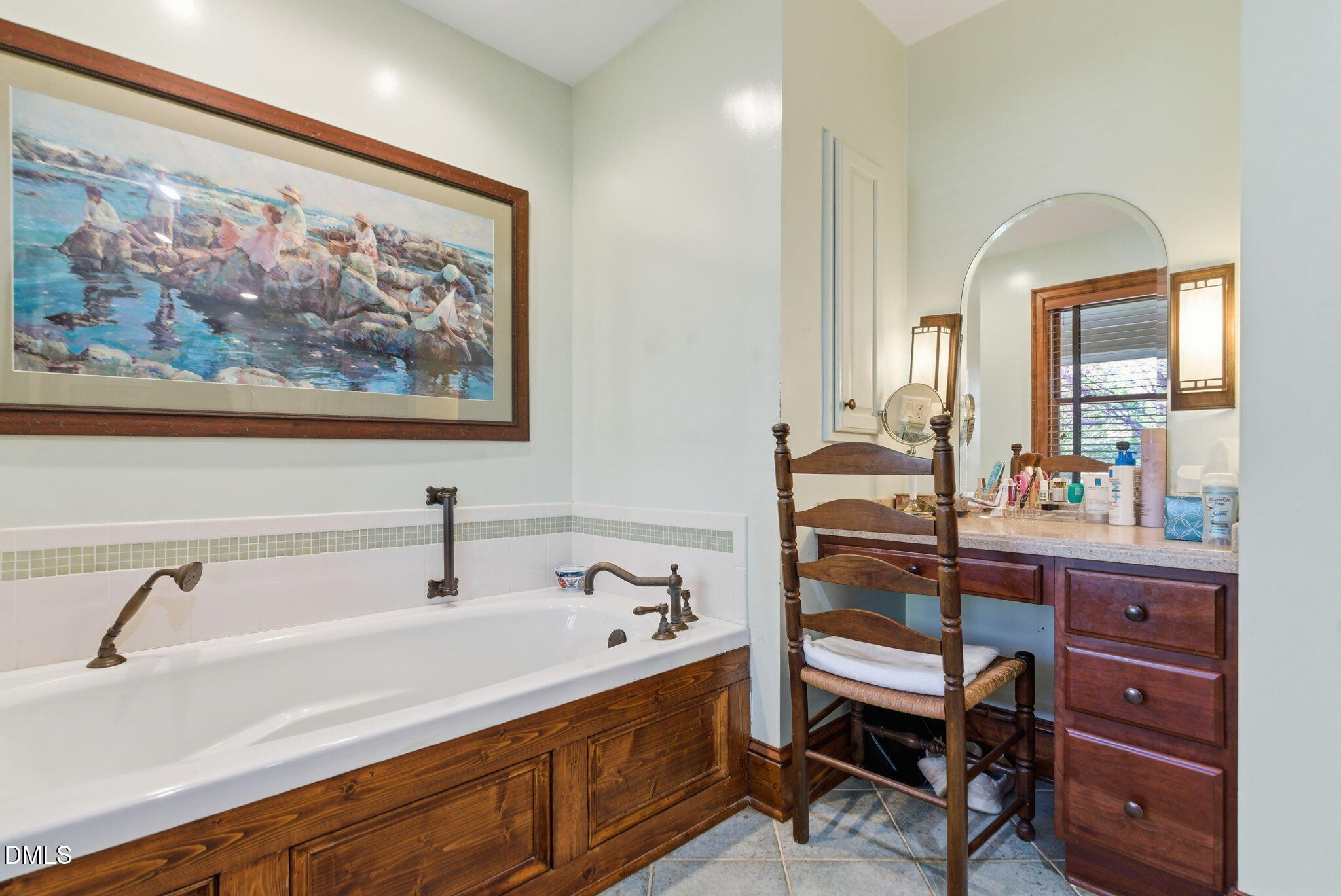 1513 Dellwood Drive Raleigh, NC 27607 - Photo 31 of 76 a bathroom with a sink and a mirror