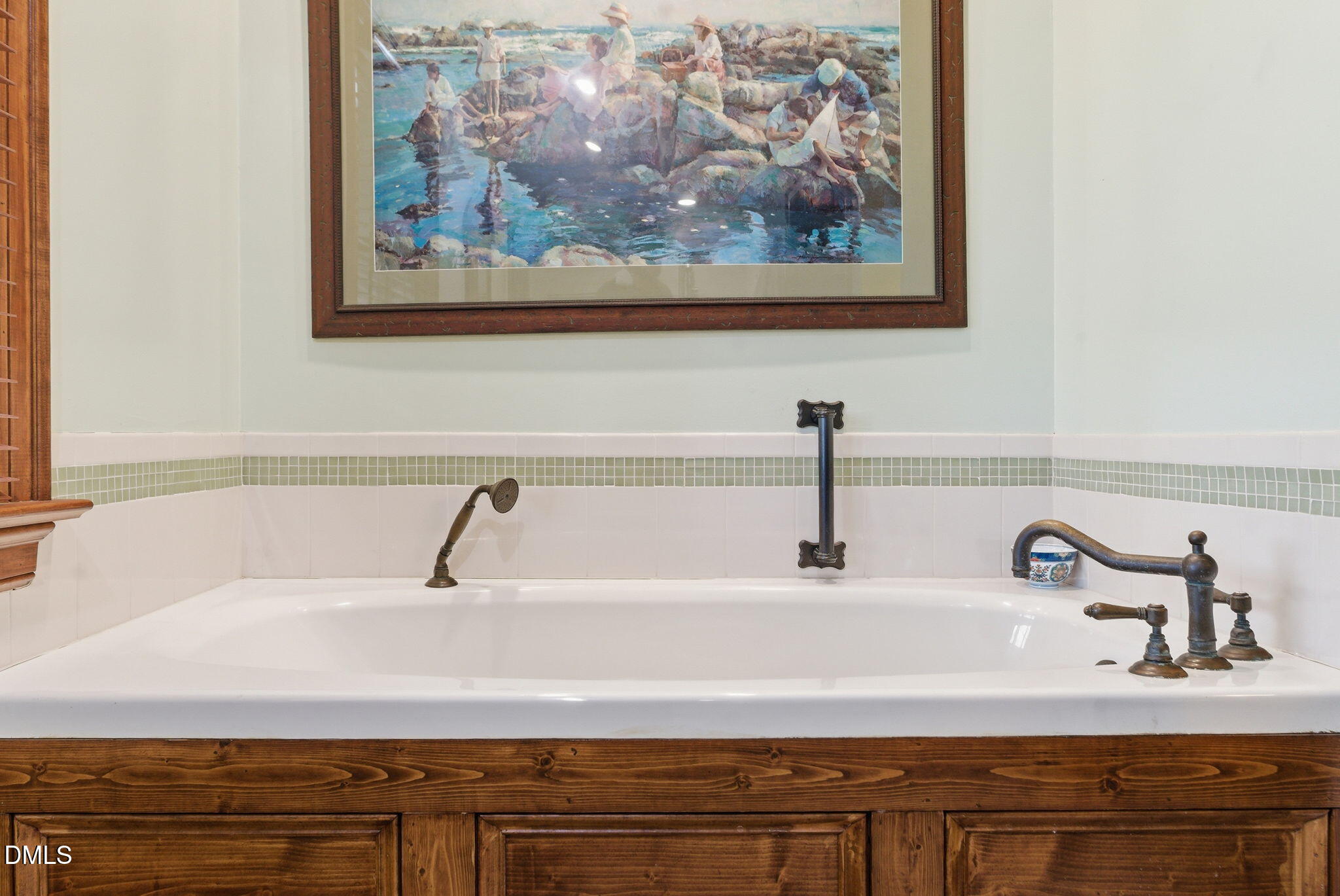 1513 Dellwood Drive Raleigh, NC 27607 - Photo 32 of 76 a bathroom with a sink and a mirror