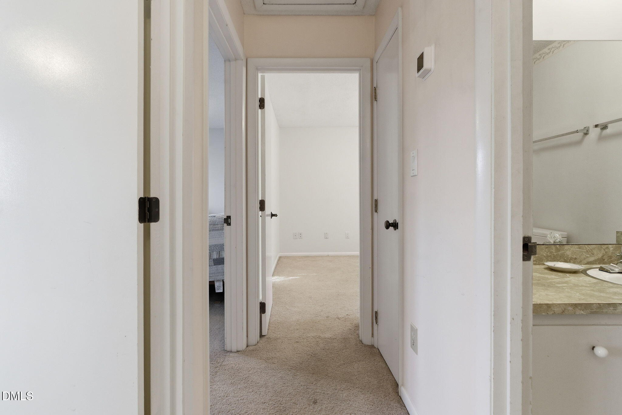 1513 Dellwood Drive Raleigh, NC 27607 - Photo 39 of 76 a view of a bathroom from a hallway