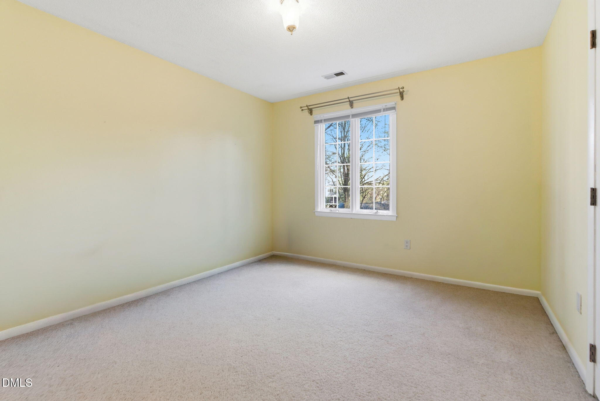 1513 Dellwood Drive Raleigh, NC 27607 - Photo 41 of 76 an empty room with windows
