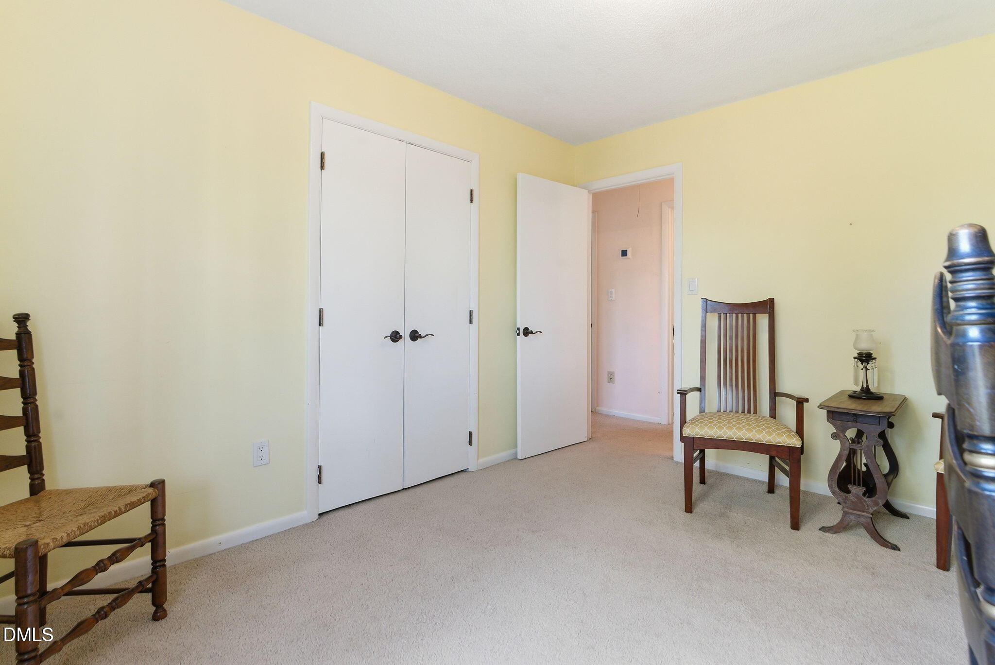 1513 Dellwood Drive Raleigh, NC 27607 - Photo 42 of 76 a room that has a bed and a chair in it