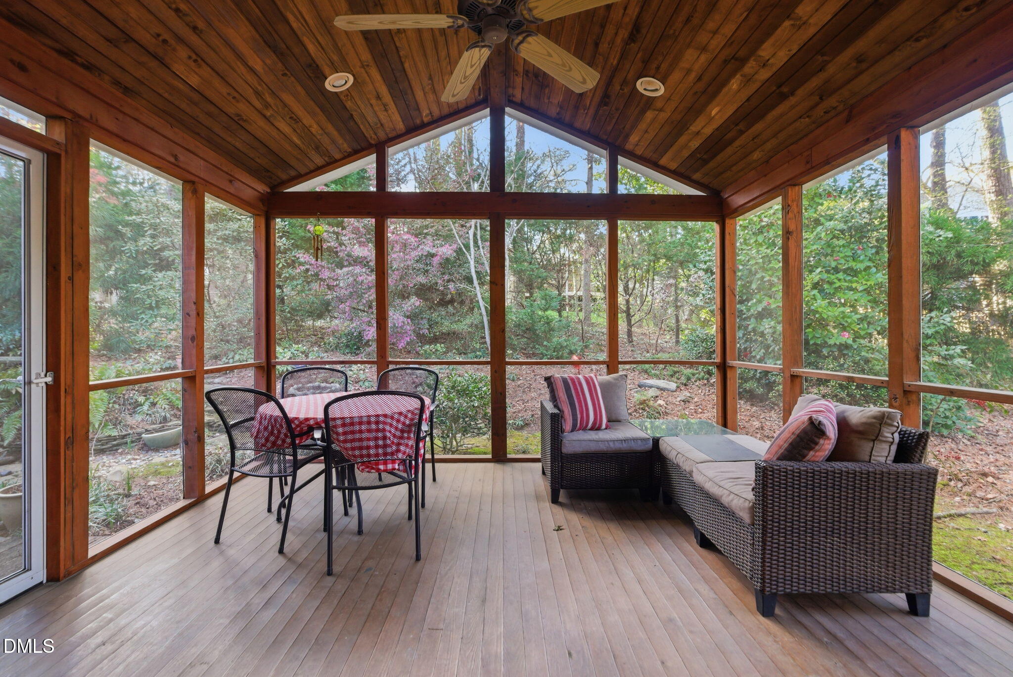 1513 Dellwood Drive Raleigh, NC 27607 - Photo 52 of 76 a living room with furniture and floor to ceiling windows