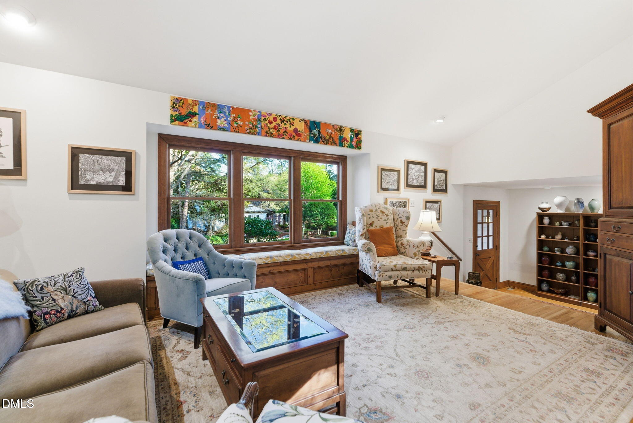 1513 Dellwood Drive Raleigh, NC 27607 - Photo 9 of 76 a living room with furniture and a floor to ceiling window