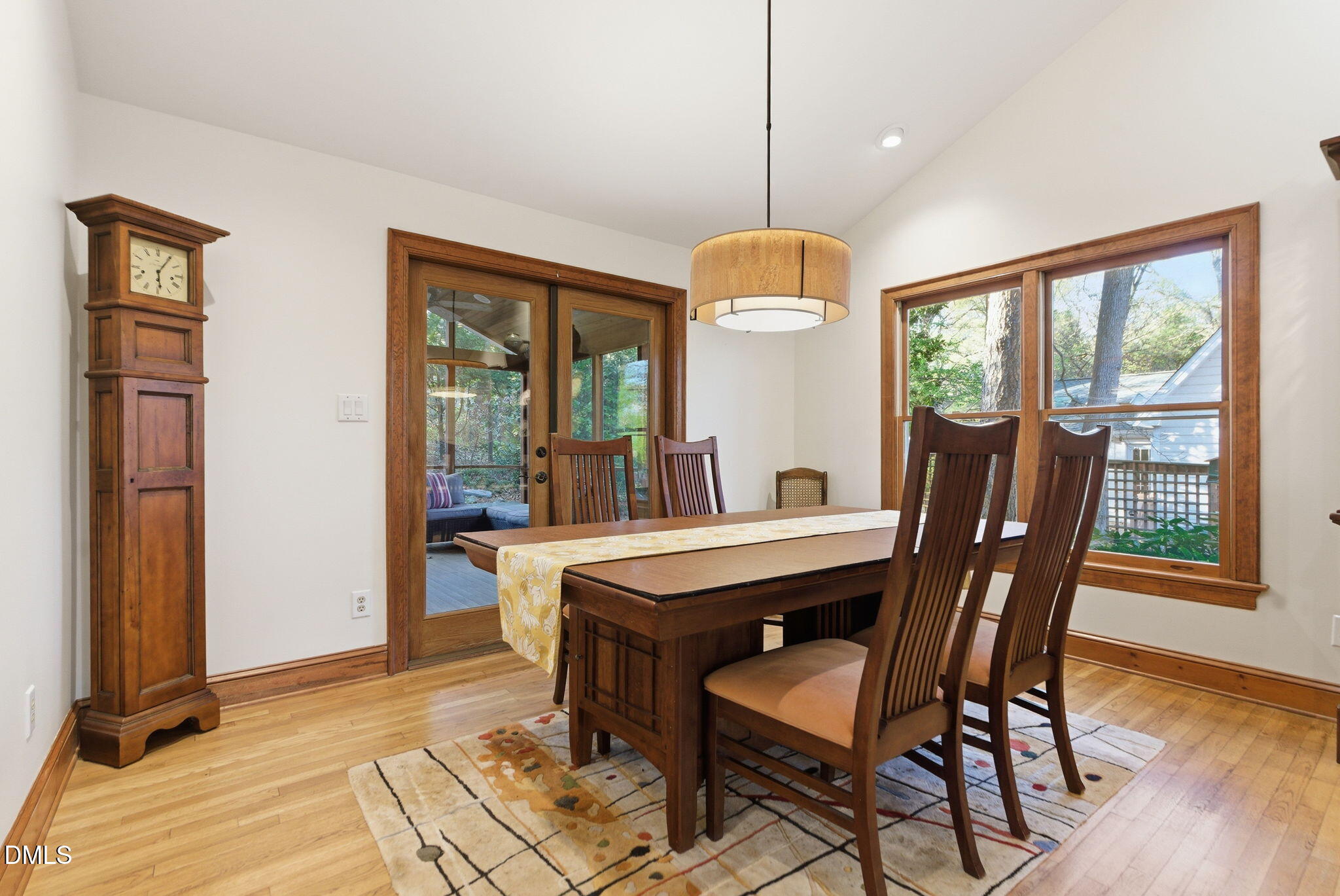 1513 Dellwood Drive Raleigh, NC 27607 - Photo 10 of 76 a view of a dining room with furniture window and wooden floor