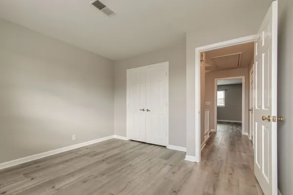a bathroom with a toilet a sink and a large mirror