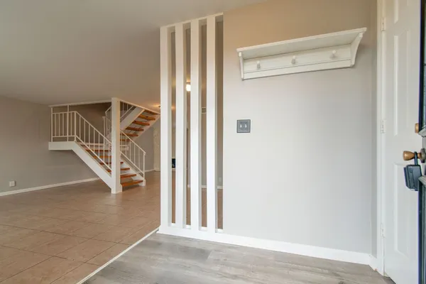a view of a livingroom with stairs