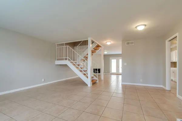 a view of an entryway with wooden floor