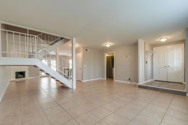 a view of an entryway with an empty room