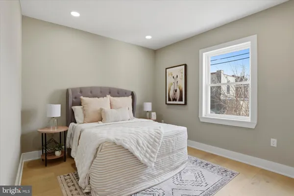 a bedroom with a bed and a bathroom