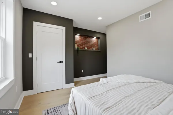a bedroom with bed and window