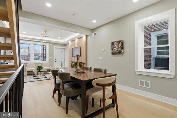 a view of a dining room with furniture and a window
