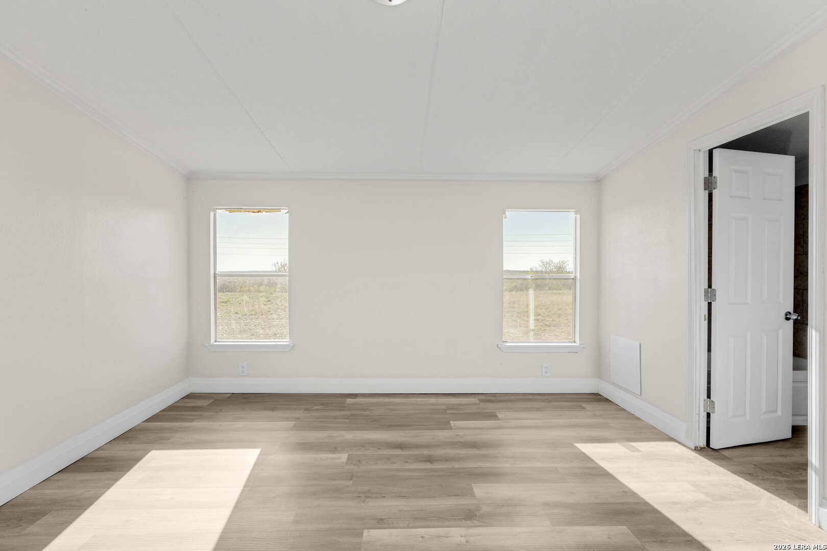 2811 County Road 467 Devine, TX 78016 - Photo 13 of 28 a view of a room that has a window in it