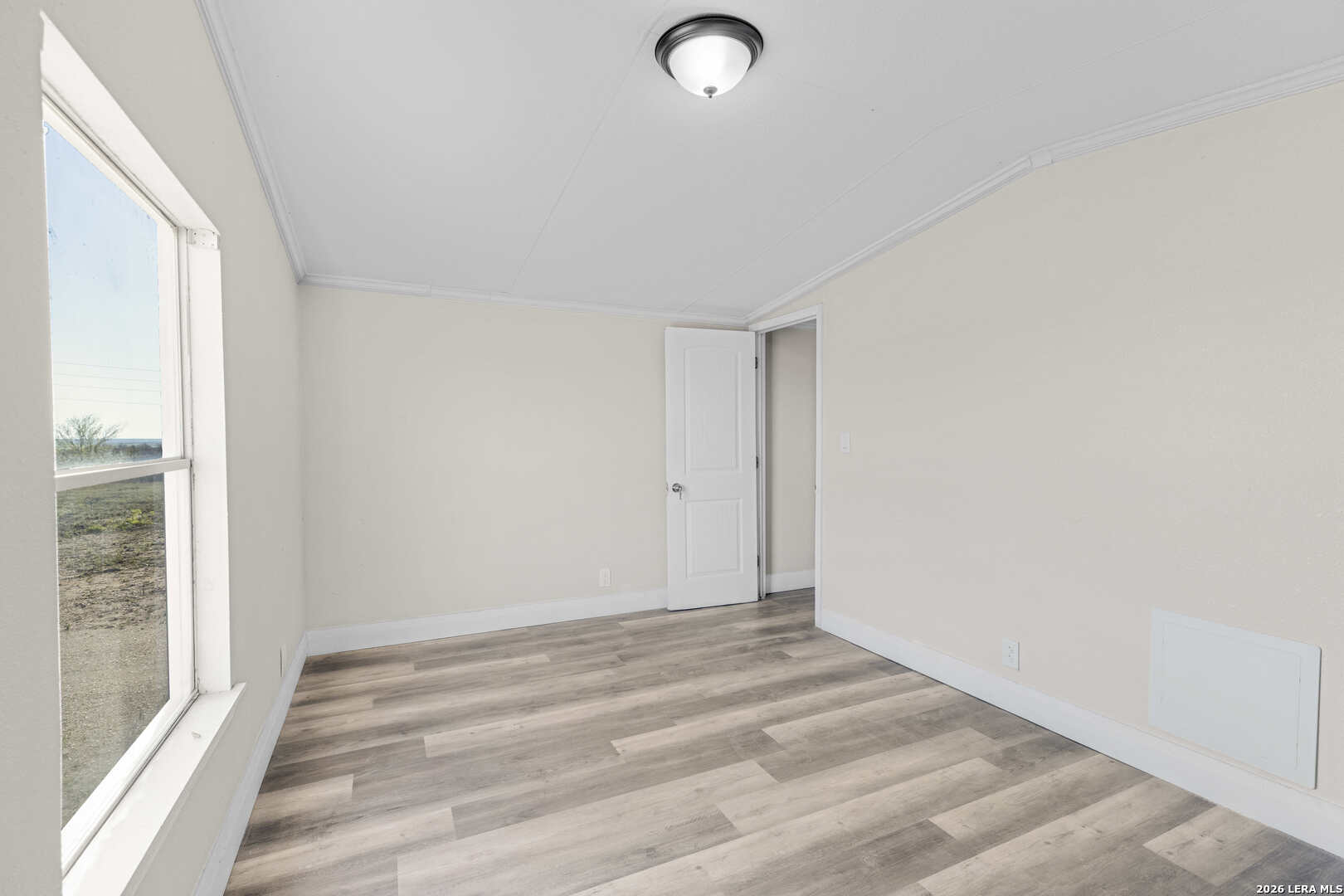 2811 County Road 467 Devine, TX 78016 - Photo 17 of 28 a view of an empty room and window