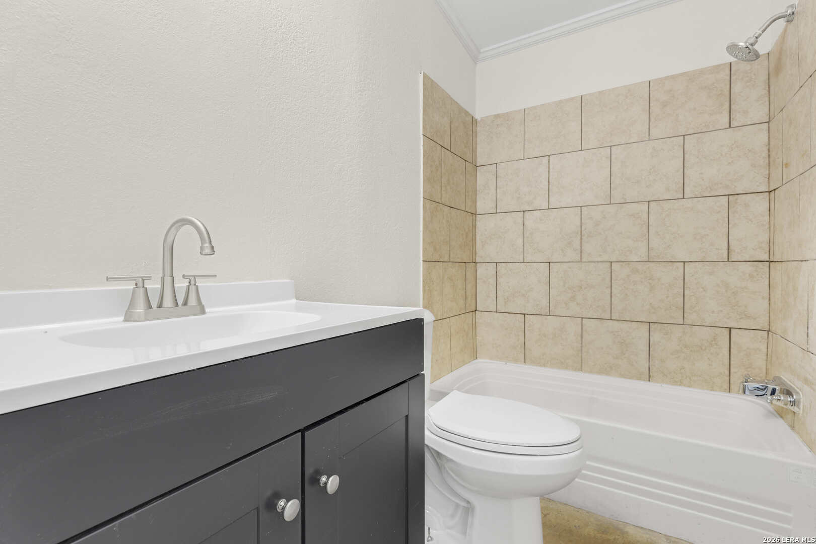 2811 County Road 467 Devine, TX 78016 - Photo 18 of 28 a bathroom with a sink a toilet and shower