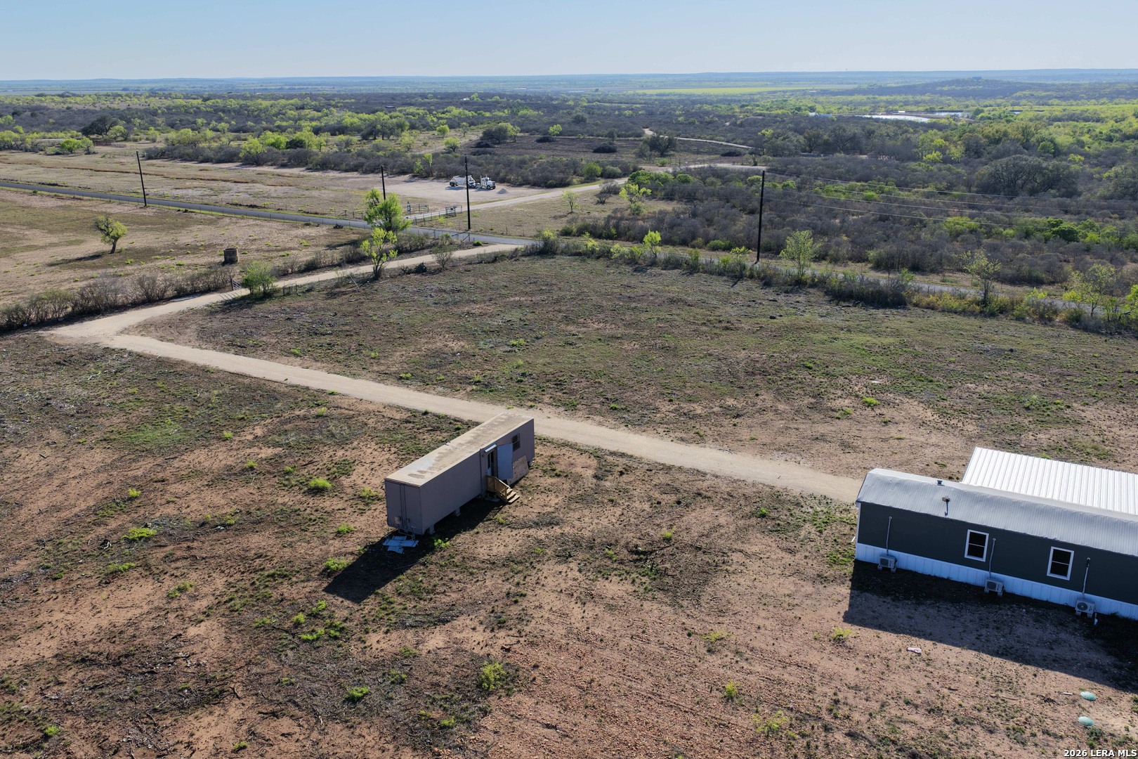2811 County Road 467 Devine, TX 78016 - Photo 4 of 28 a view of a yard with an outdoor space