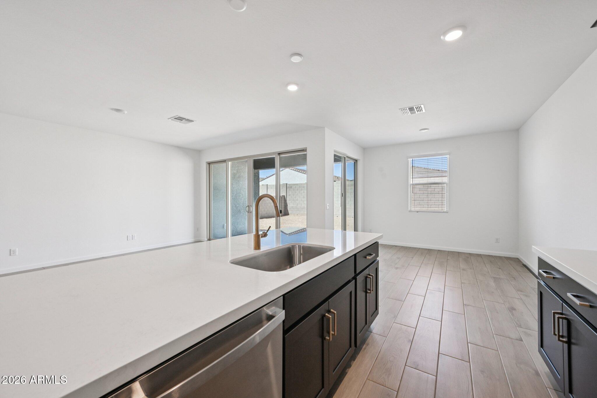 16206 West Red Bird Road Surprise, AZ 85387 - Photo 11 of 35 a kitchen with sink and cabinets