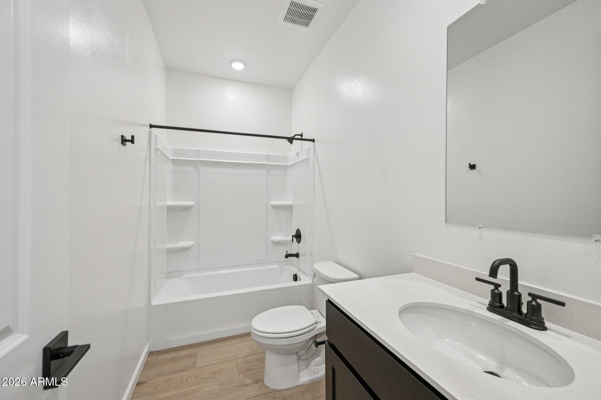 16206 West Red Bird Road Surprise, AZ 85387 - Photo 21 of 35 a bathroom with a sink toilet and shower
