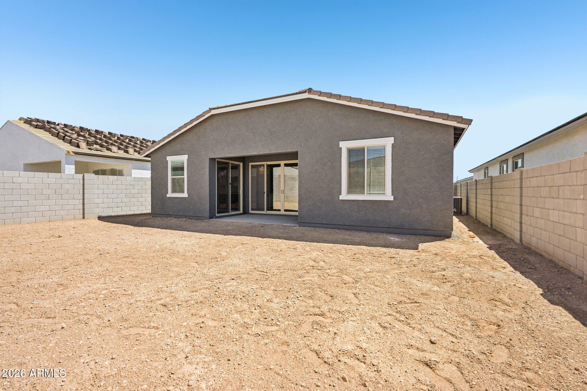 16206 West Red Bird Road Surprise, AZ 85387 - Photo 28 of 35 a house with yard in front of it