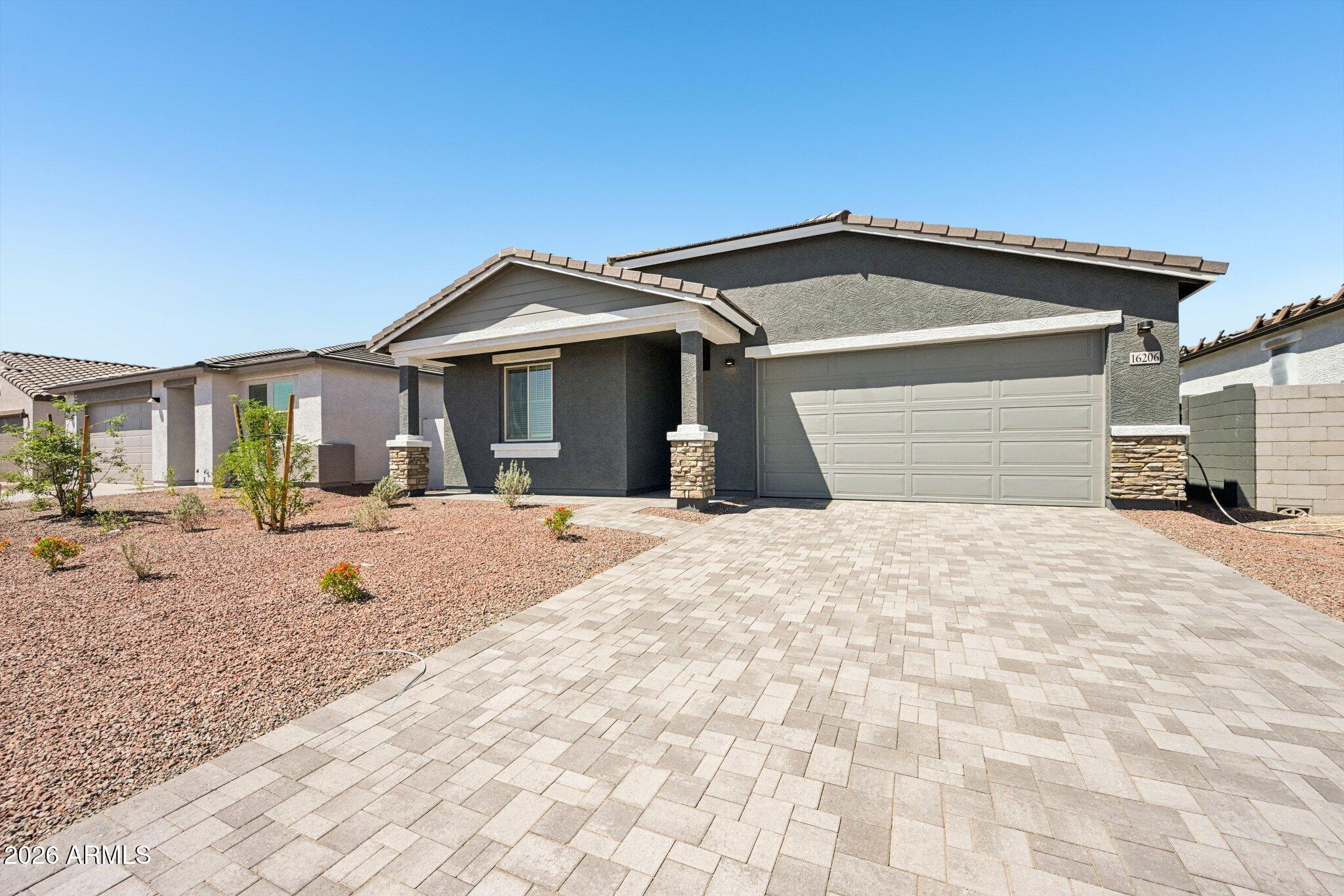 16206 West Red Bird Road Surprise, AZ 85387 - Photo 3 of 35 a view of a house with snow on the road